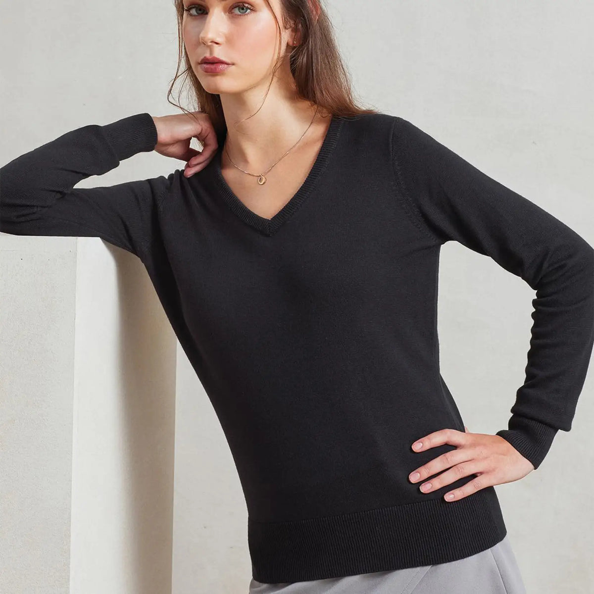 Model wearing the Premier Ladies Knitted Cotton Acrylic V Neck Sweater PR696.