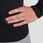 Cuff/hem close-up of model wearing the Premier Ladies Knitted Cotton Acrylic V Neck Sweater PR696.