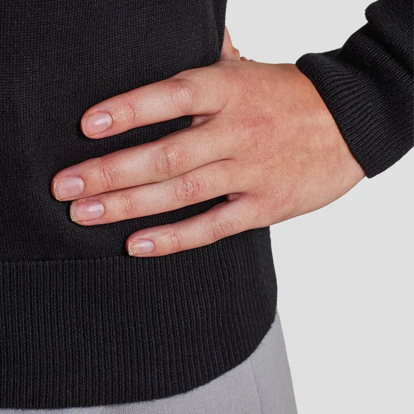 Cuff/hem close-up of model wearing the Premier Ladies Knitted Cotton Acrylic V Neck Sweater PR696.