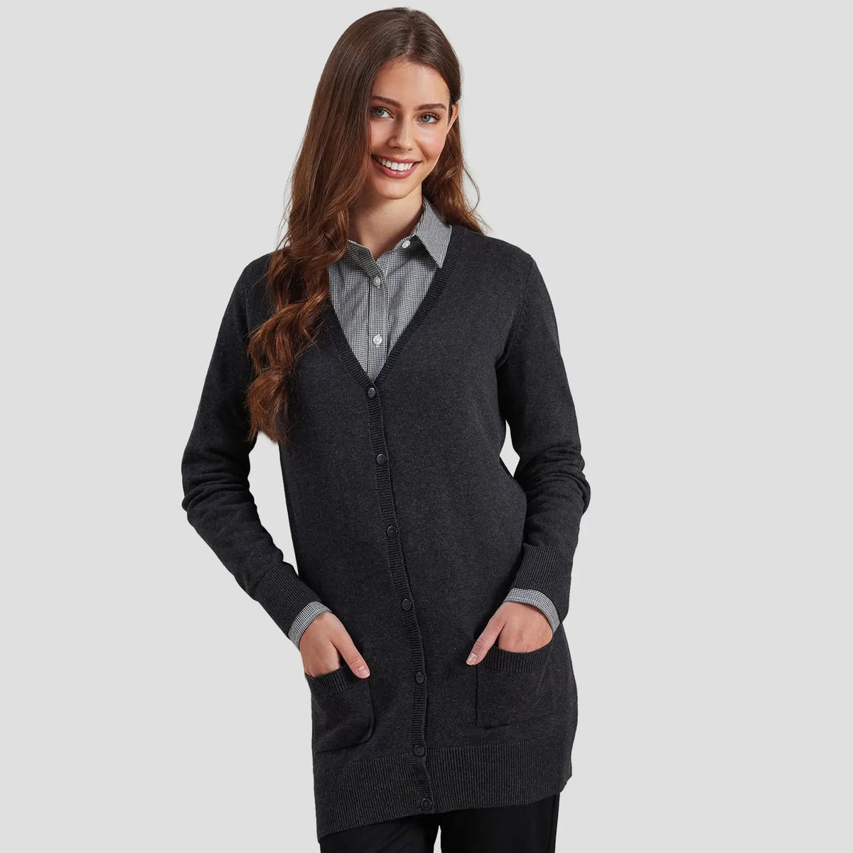 Model wearing the Premier Ladies Longline V Neck Cardigan PR698.