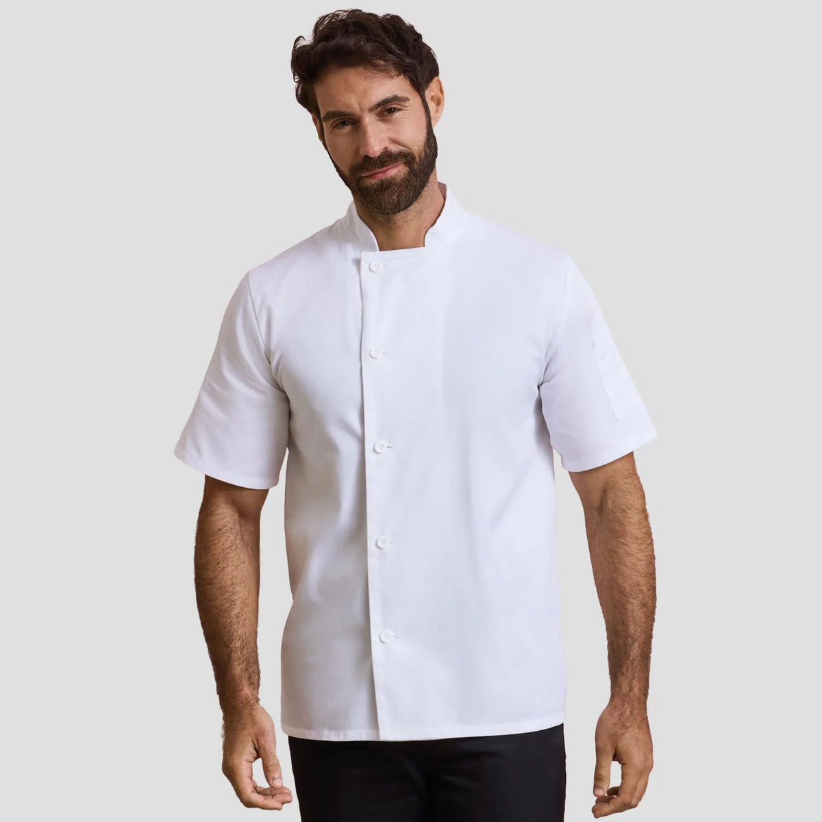 Model wearing the Premier Essential Short Sleeve Chef's Jacket PR900.