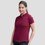 Model wearing the Pro RTX Ladies Pro Polyester Polo Shirt in Burgundy