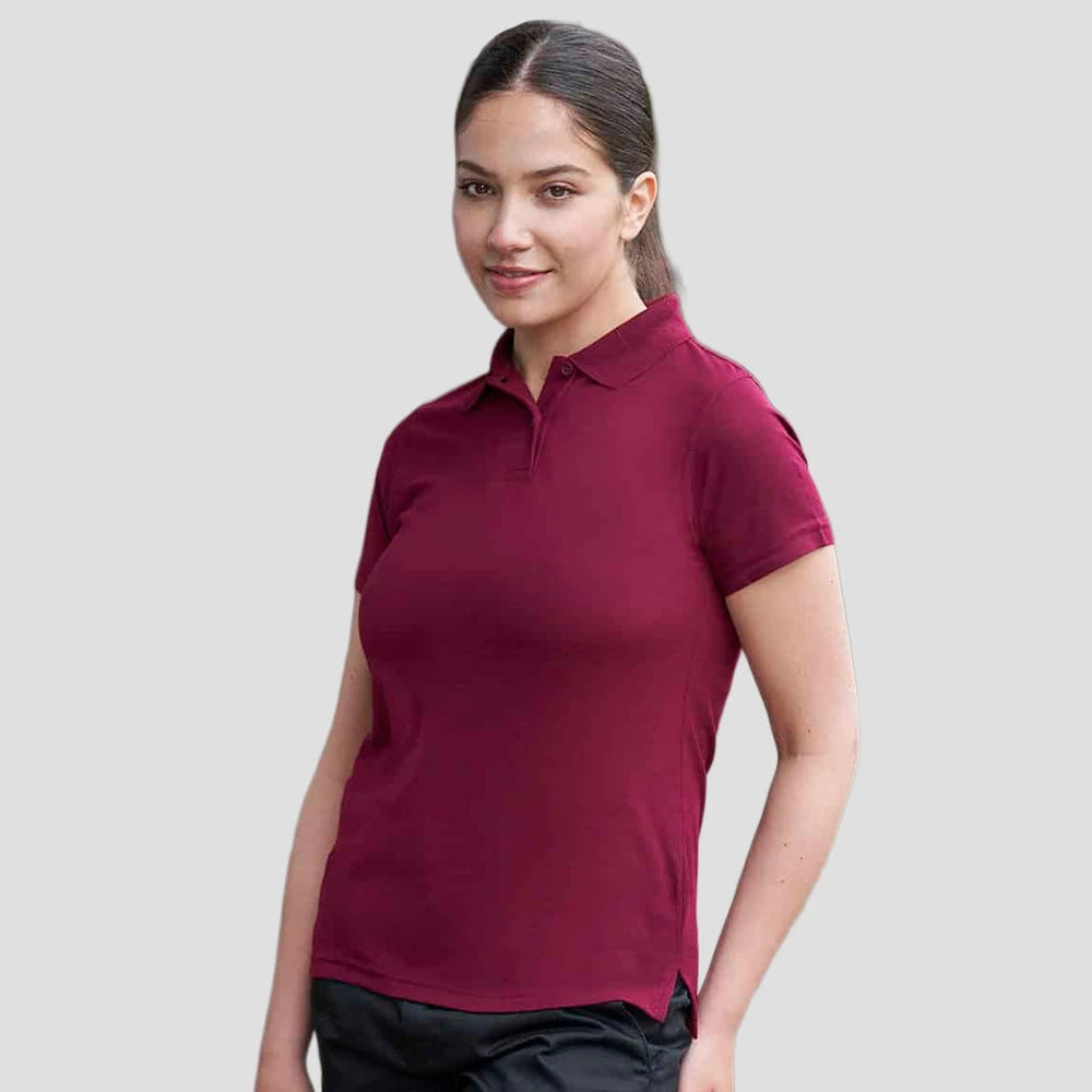 Model wearing the Pro RTX Ladies Pro Polyester Polo Shirt in Burgundy