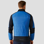 Rear view of Model wearing the Regatta E-Volve Unisex Thermal Hybrid Jacket in Strong Blue/Navy