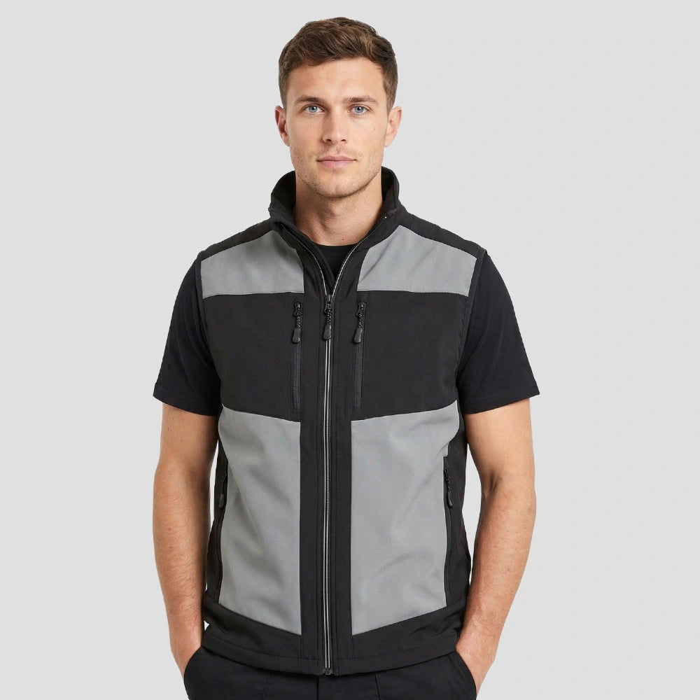 Model wearing the Regatta E-Volve Unisex Two Layer Soft Shell Bodywarmer in Mineral Grey / Black