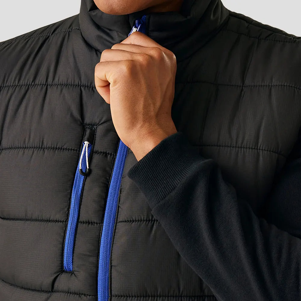 Close-up shot of model wearing the Regatta Navigate Thermal Bodywarmer in Black / New Royal Blue