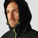Close-up of model wearing the Regatta Navigate Two Layer Hooded Soft Shell Jacket RG454 in Black / Lime Green, showcasing the hood