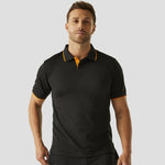 Model wearing the Regatta Navigate Polo Shirt in Black / Orange