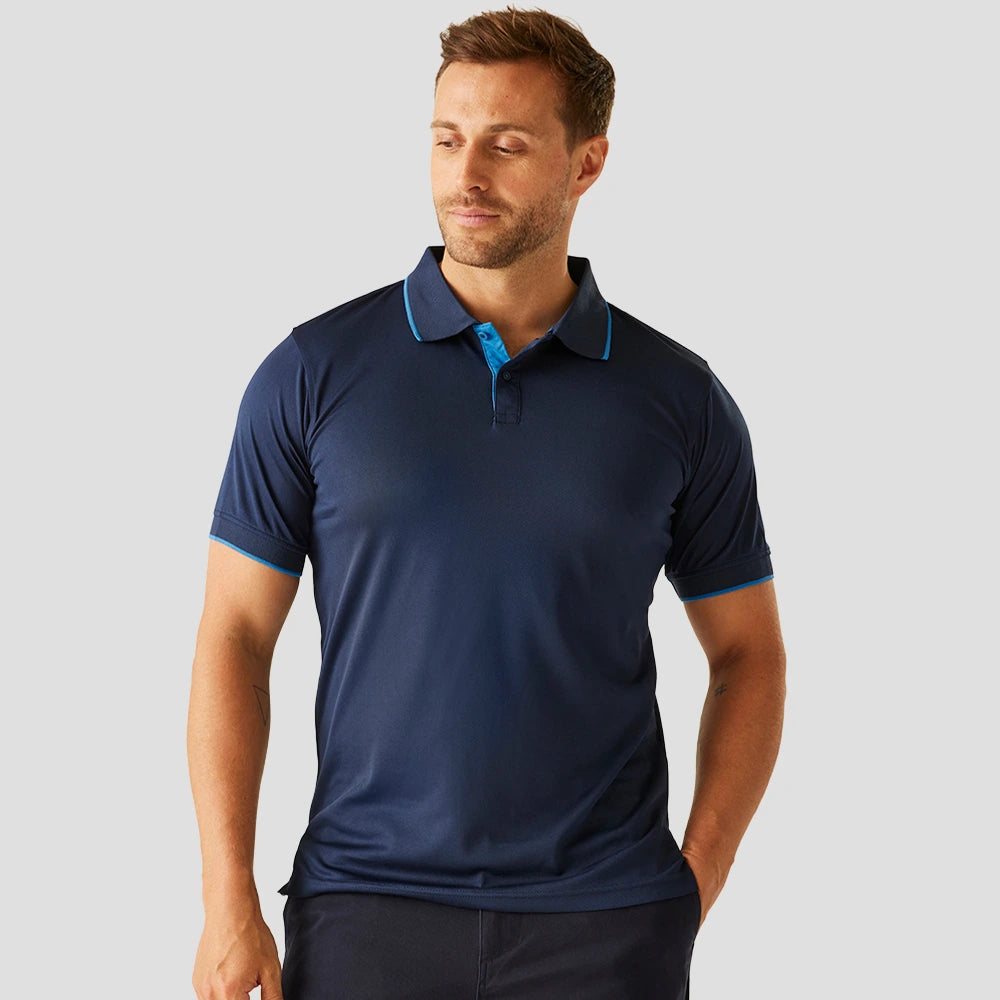Model wearing the Regatta Navigate Polo Shirt in Navy / French Blue