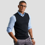 Model wearing the Russell Collection Sleeveless Cotton Acrylic V Neck Sweater 716M in Black