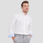 Model wearing the Russell Collection Tailored Long Sleeve Washed Oxford Shirt 920M in white