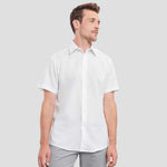 Model wearing the Russell Collection Short Sleeve Tailored Oxford Shirt in white