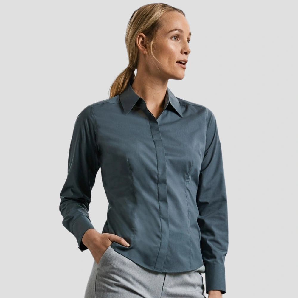 Model wearing the Russell Collection Ladies Long Sleeve Fitted Poplin Shirt 924F in Convoy Grey