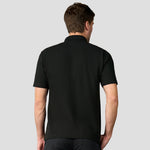 Rear view of model wearing the R101 Pro RTX Pique Polo Shirt in Black