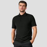 Rear view of model wearing the R101 Pro RTX Pique Polo Shirt in Black