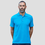 Model wearing the RX101 Pro RTX Pro Piqué Polo Shirt in Bottle Green
