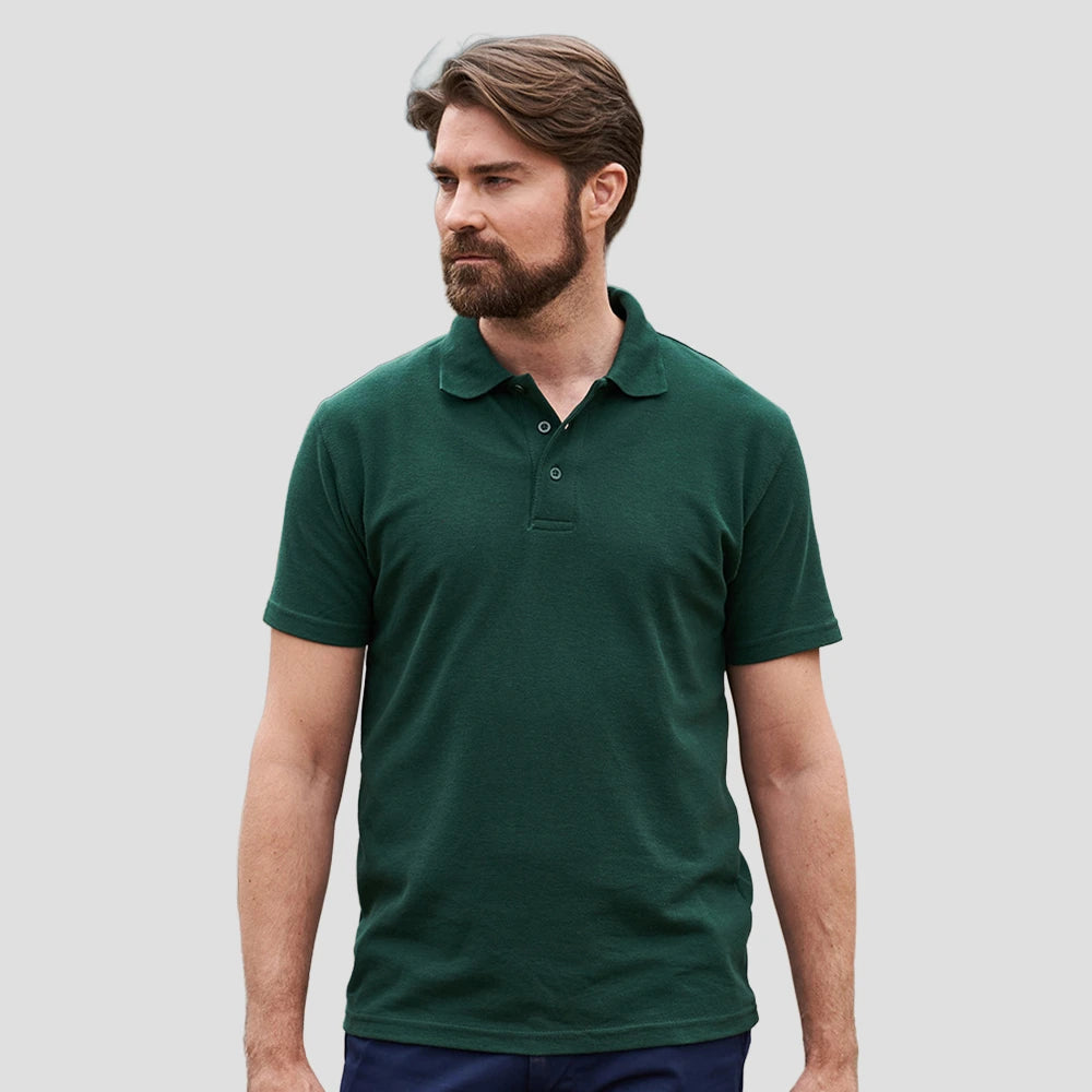 Model wearing the RX101 Pro RTX Pro Piqué Polo Shirt in Bottle Green