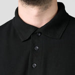 Close-up placket of the R110 Pro RTX Pique Polo Shirt in Black