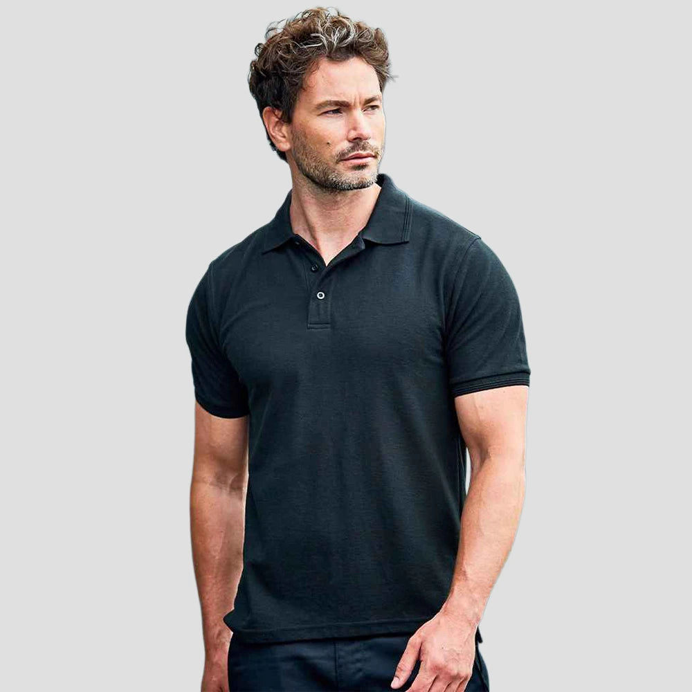 Model wearing the Pro RTX Pro Premium Piqué Polo Shirt in Black