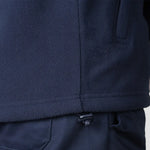 Model wearing the Pro RTX Pro Fleece Jacket in Navy - hem close up