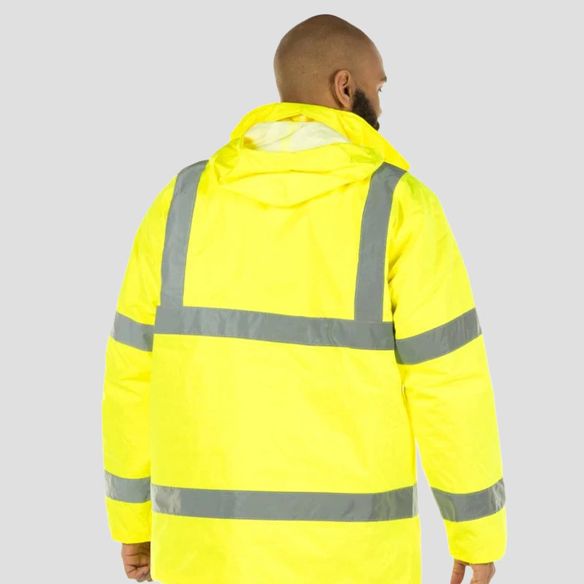 Rear view of model wearing the Portwest Hi-Vis Traffic Jacket S460 in Yellow.
