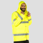 Model wearing the Portwest Hi-Vis Traffic Jacket S460 in Yellow with hood up.