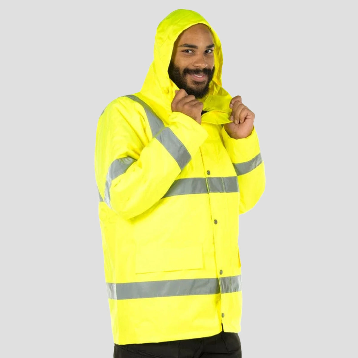 Model wearing the Portwest Hi-Vis Traffic Jacket S460 in Yellow with hood up.