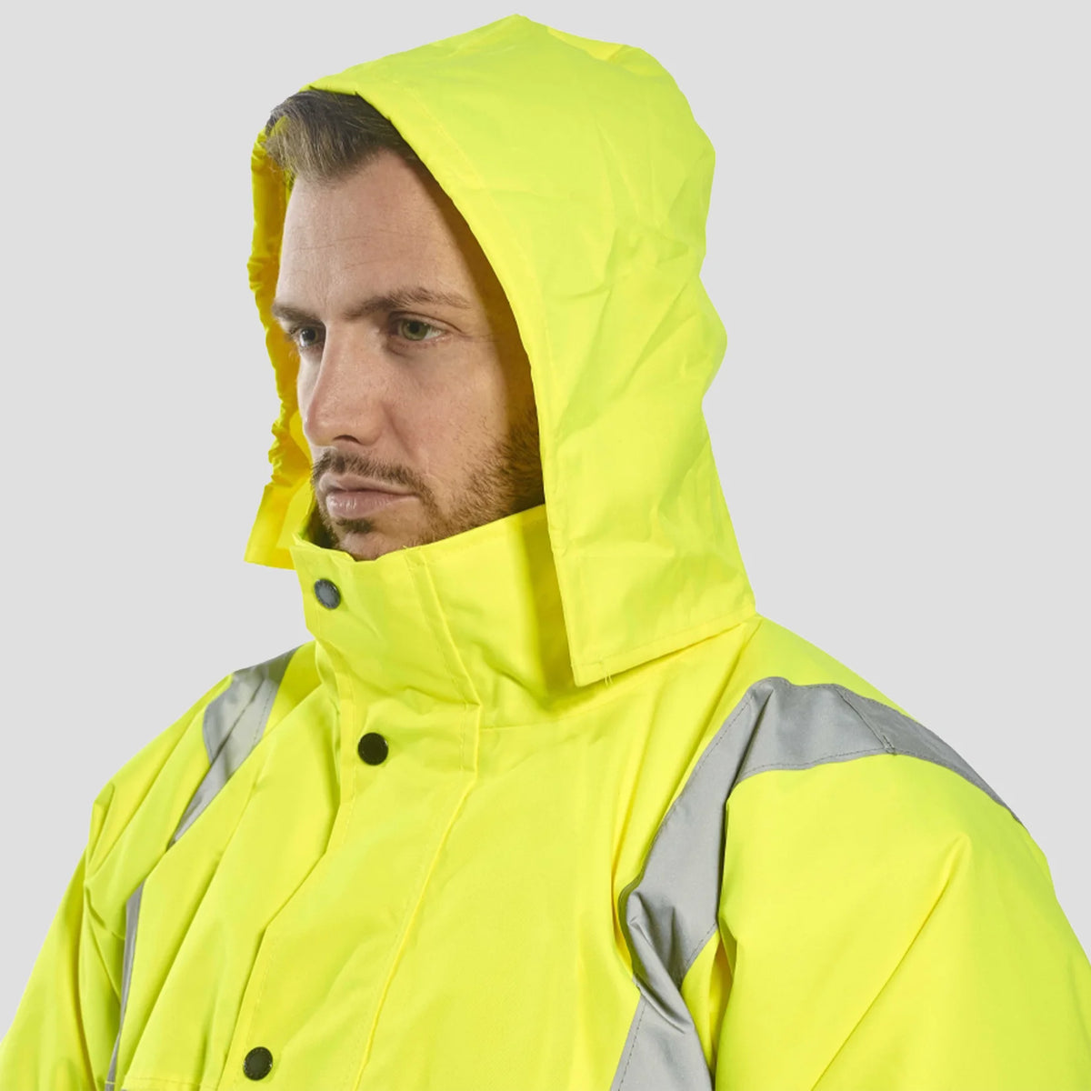 Model wearing the Portwest Hi-Vis Winter Bomber Jacket S463 in Yellow - hood up.
