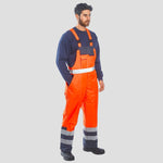 Model wearing the Portwest Hi-Vis Breathable Contrast Rain Bib and Brace S488 in Orange/Navy.