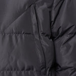 Close-up fabric view of the Surridge Sport Long Padded Bench Coat in Black.