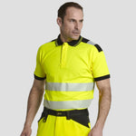 Model wearing yellow and black Portwest - PW3 Hi-Vis Cotton Comfort Polo Shirt S/S