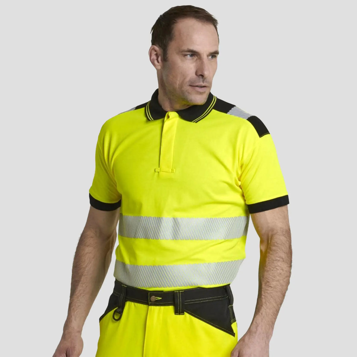 Model wearing yellow and black Portwest - PW3 Hi-Vis Cotton Comfort Polo Shirt S/S