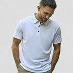 model wearing Tee Jays Luxury Sport Polo Shirt