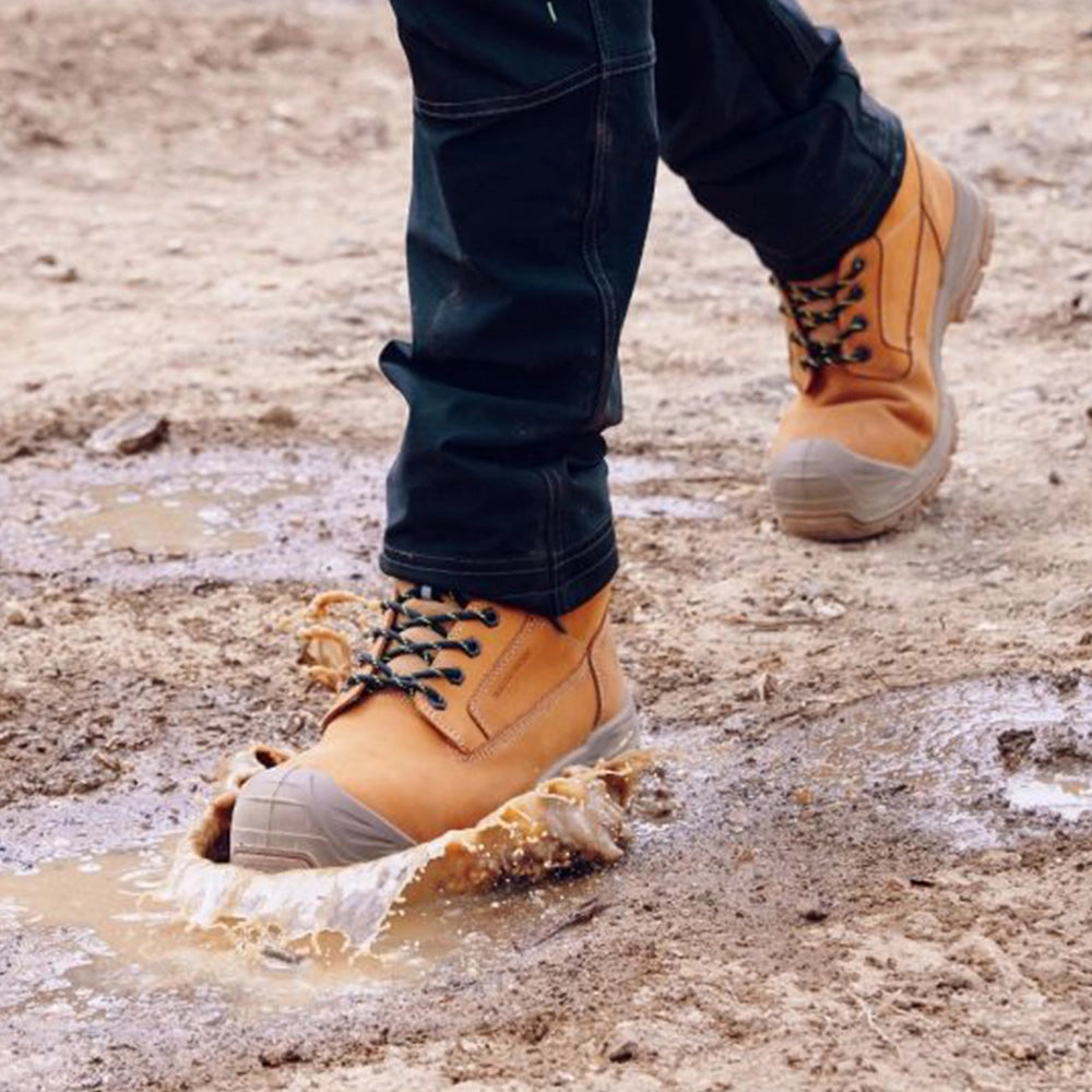 model splashing in Thompson Wheat Waterproof Boot S7S