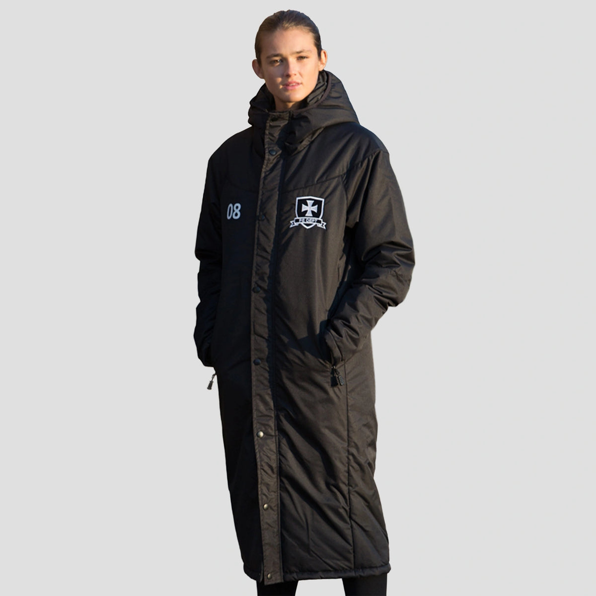 Youth model wearing the Chadwick Textiles Touchline Coat 827.