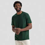 model wearing Uneek Olympic T-shirt UC320 in bottle