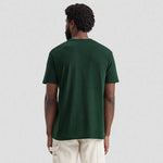 back view of model wearing Uneek Olympic T-shirt UC320 bottle
