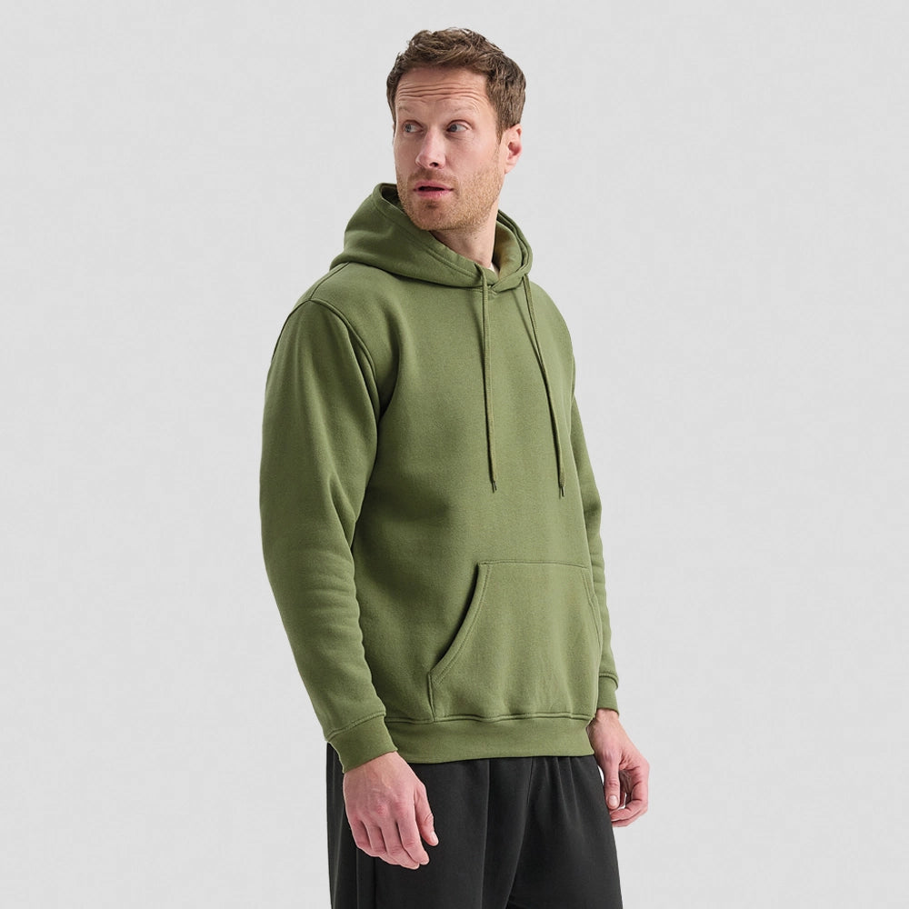 Man wearing a green Classic Hooded Sweatshirt UC502 on a light grey background