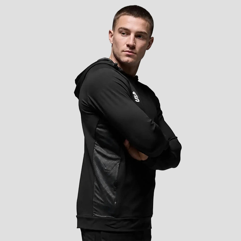 Model wearing the Surridge Sport VOLT Hoodie in Black.