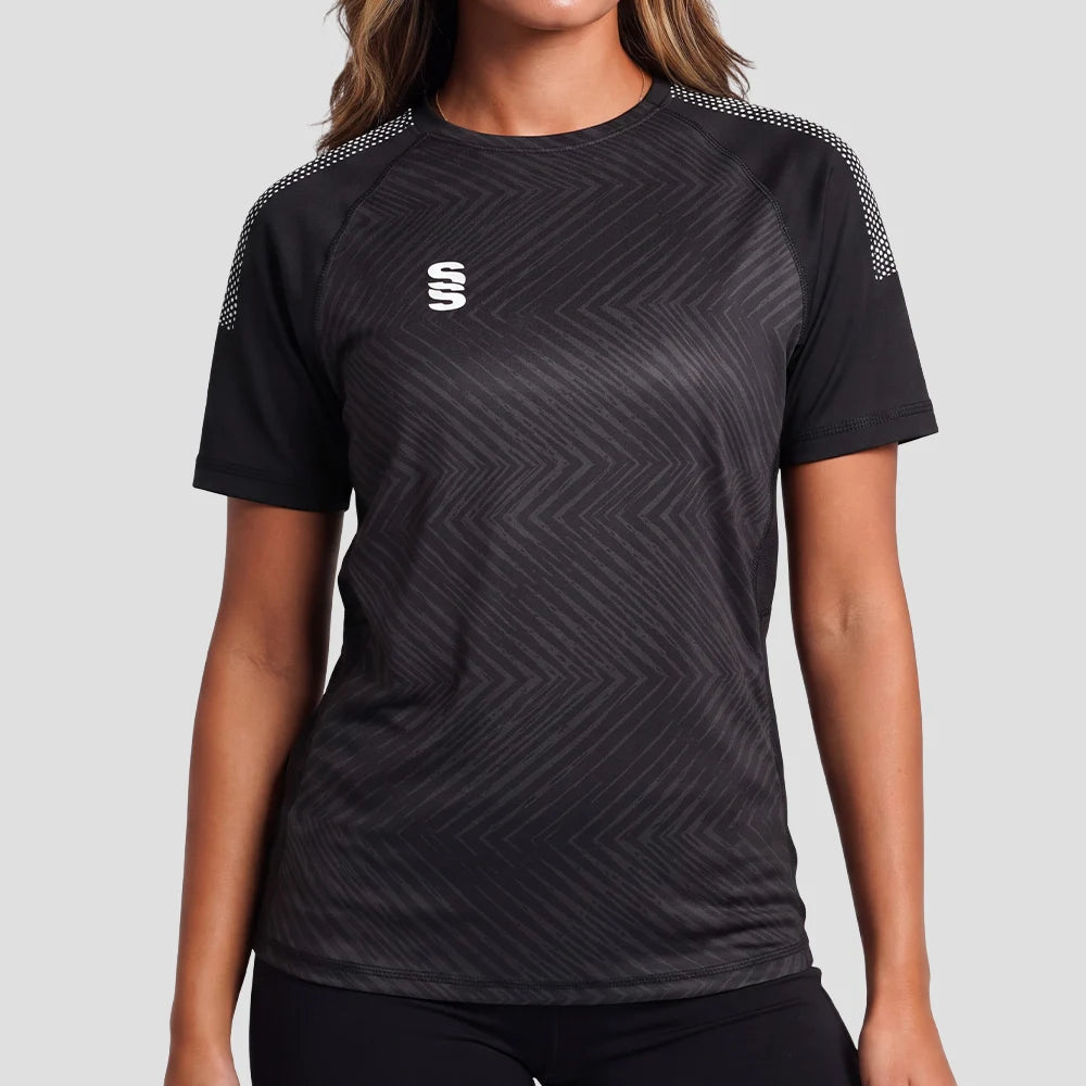 Model wearing the Surridge Sport Women's Volt T-Shirt in Black with White Dots.
