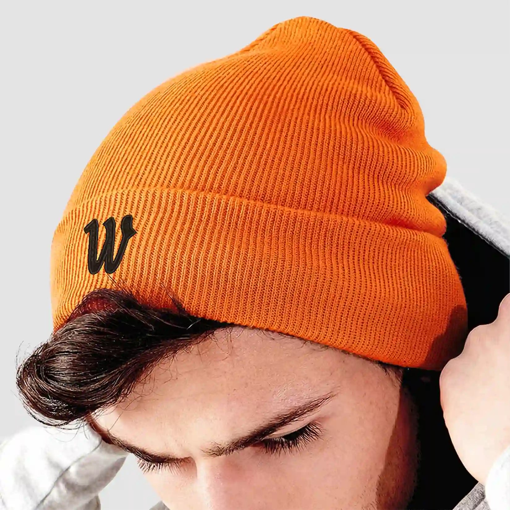 Model wearing the Winsford ASC Cuffed Beanie (Orange) BB45