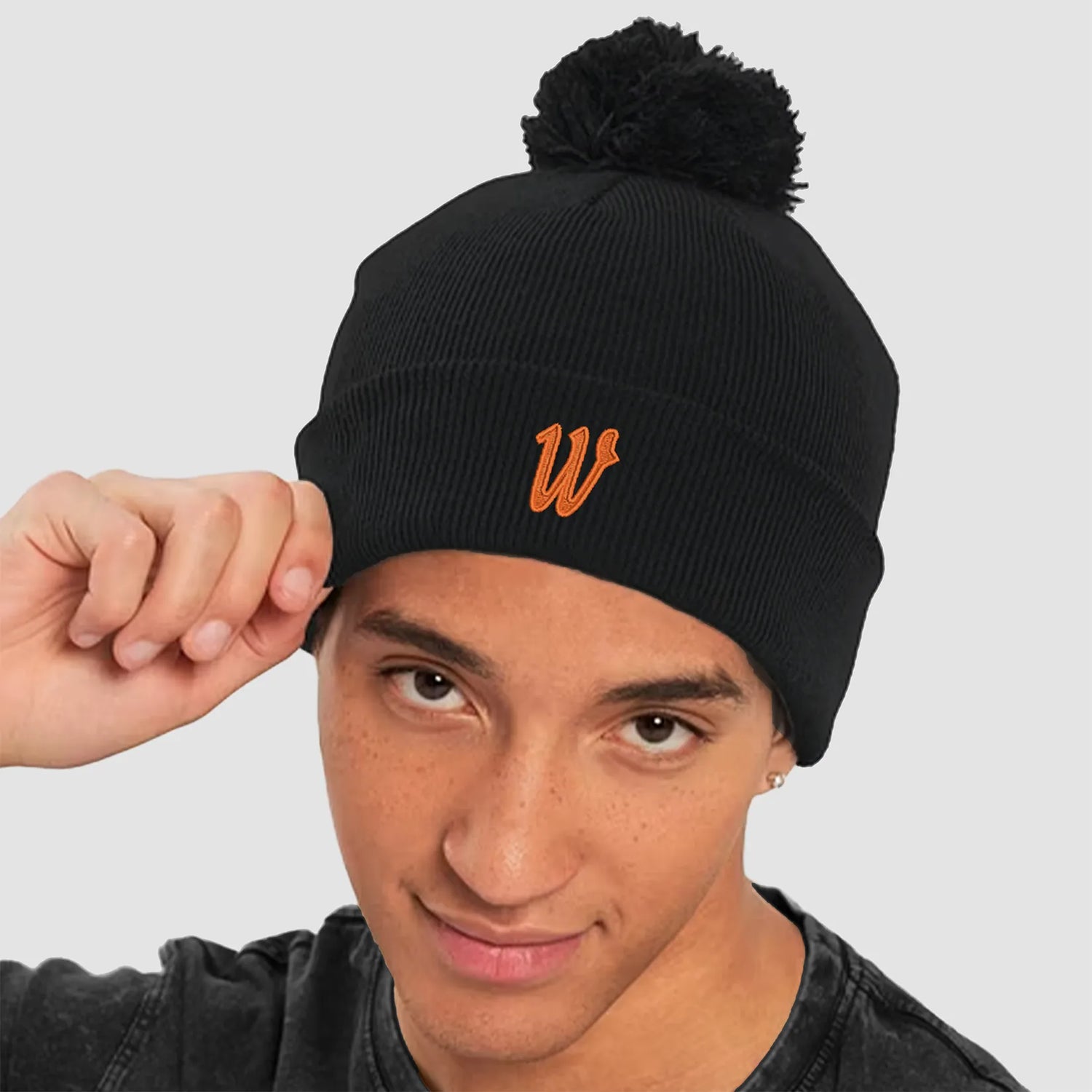 Model wearing the Winsford ASC Cuffed Bobble Beanie (Black) BC426