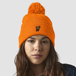 Model wearing the Winsford ASC Cuffed Bobble Beanie (Orange) BC426
