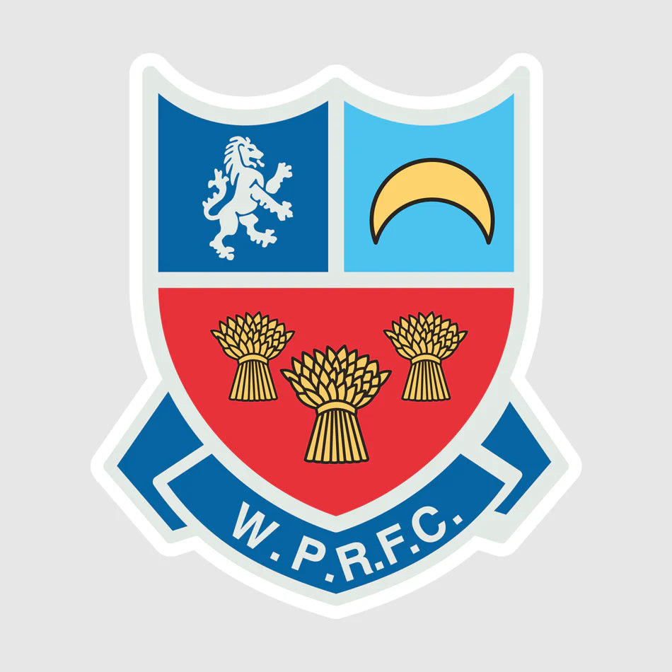 Winnington Park RFC logo, modern shield design featuring three golden wheatsheaves on a red background, a silver lion, and a gold crescent on blue panels with a blue banner reading W.P.R.F.C, representing the official branding for Winnington Park Rugby Football Club in Cheshire