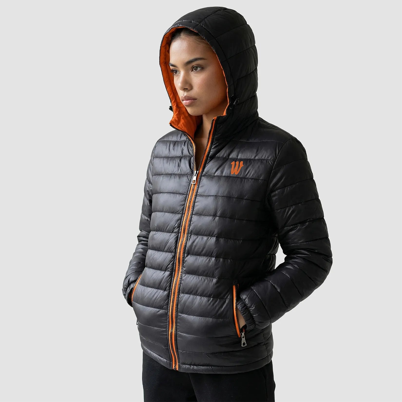 Model wearing the Winsford ASC Padded Jacket – Adults RS233M in Black / Orange