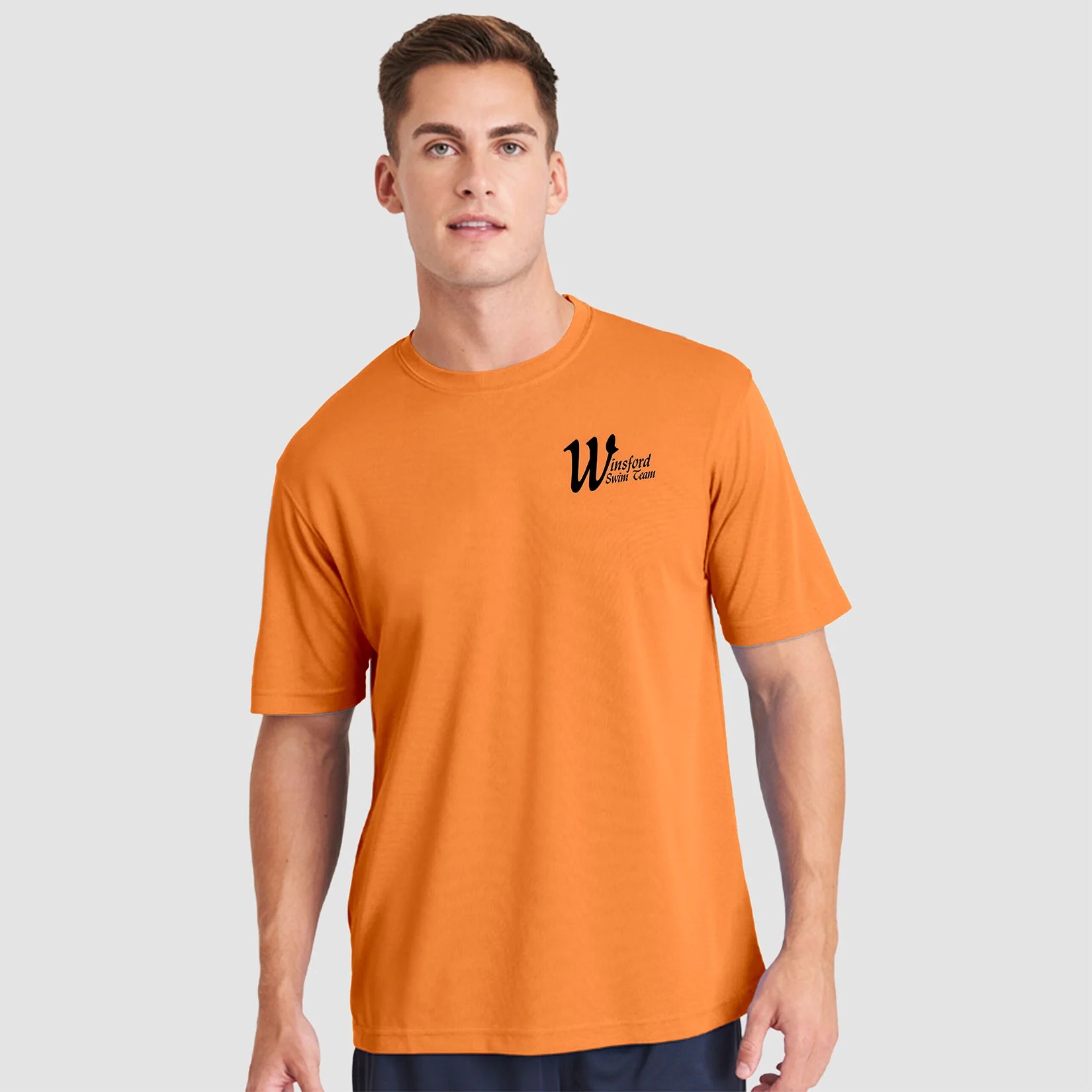 Model wearing the Winsford ASC Team T-Shirt – Adult (Orange) JC001