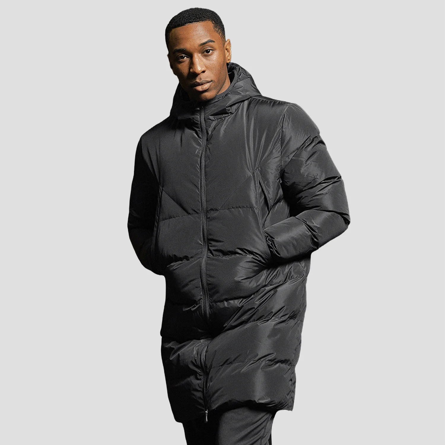 Model wearing the Surridge Sport Active Long Padded Coat WL005 in Black.
