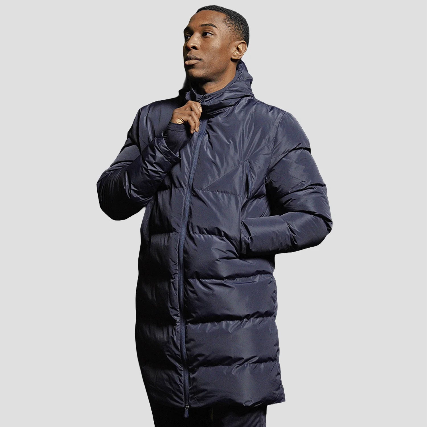 Model wearing the Stuart Surridge Active Long Padded Coat WL005 in Navy.