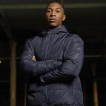 Model wearing the Stuart Surridge Active Long Padded Coat WL005 in Navy.
