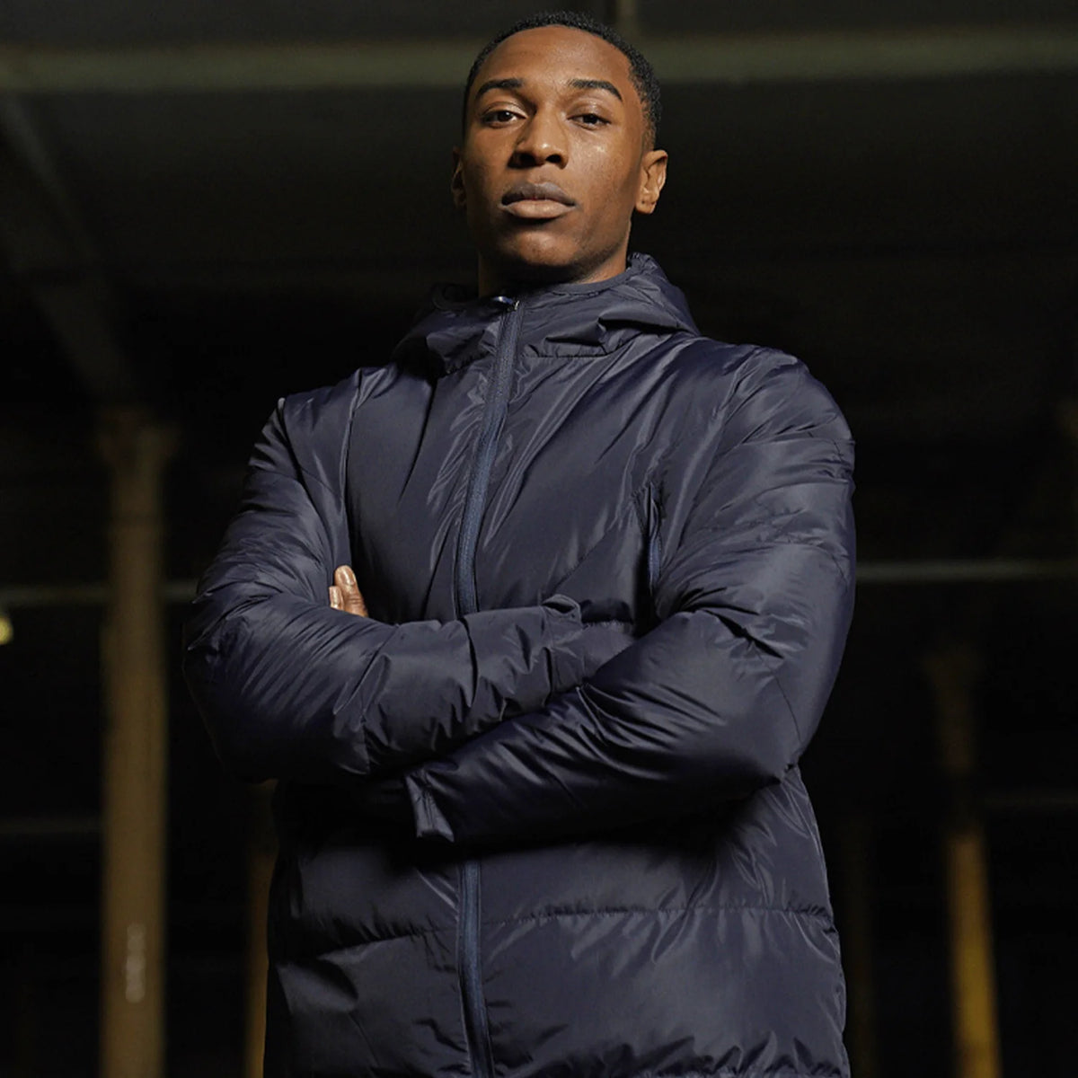 Model wearing the Stuart Surridge Active Long Padded Coat WL005 in Navy.